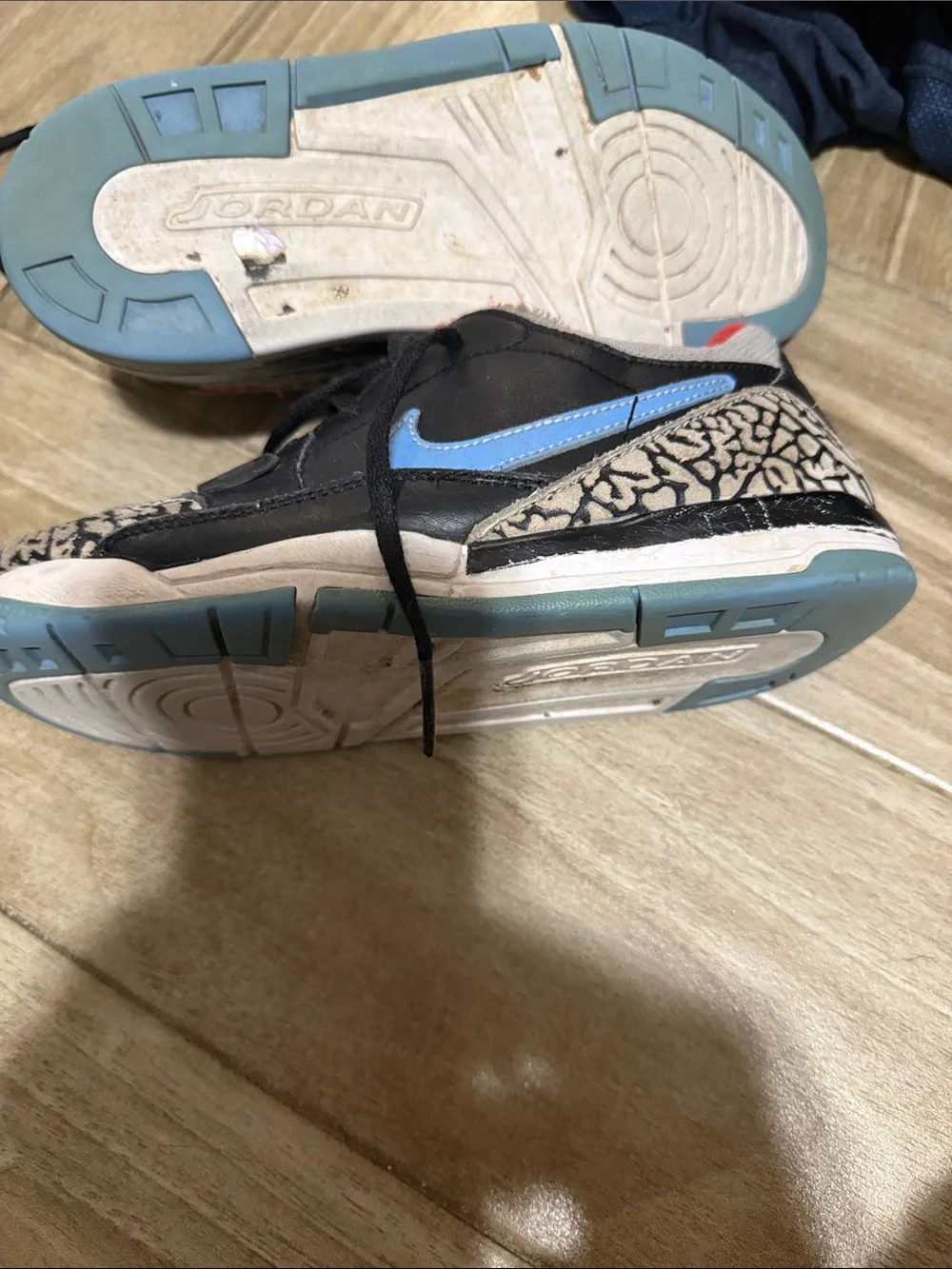 Nike Kids Black Sneakers with Red Lining and Blue Swoosh